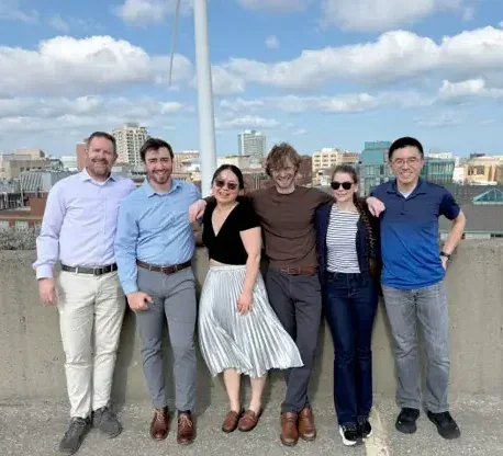 Taylor Lab members on a rooftop on the Case Western Reserve University campus